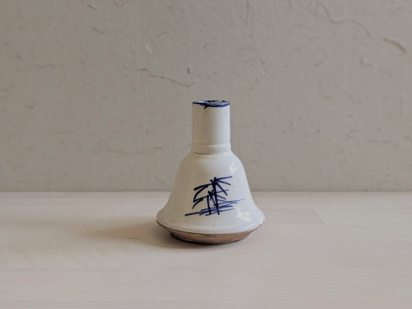 Bell-shaped pottery vase with abstract hand-writhing