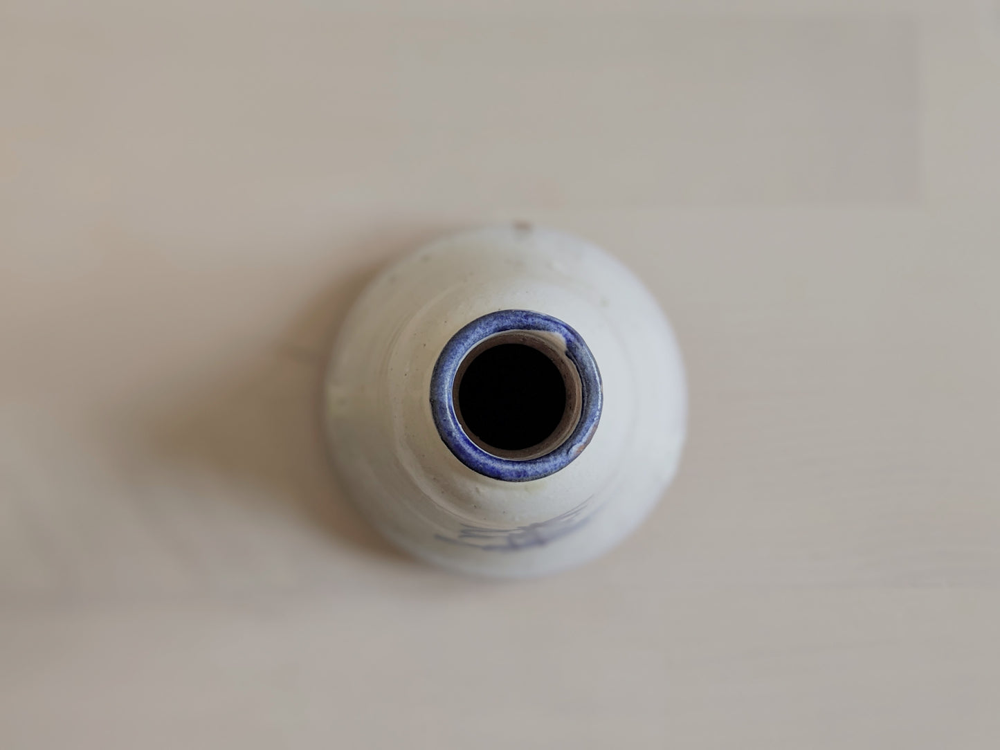 Bell-shaped pottery vase with abstract hand-writhing