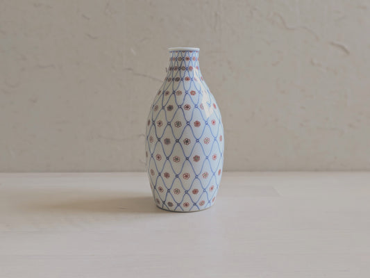 Vintage sake bottle with fishnet and flower pattern